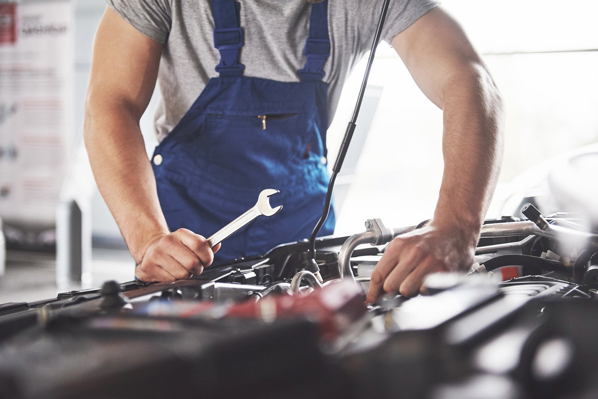 Santee CDJR service technician repairing a vehicle
